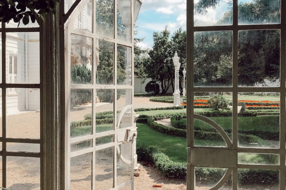 a white framed green house door